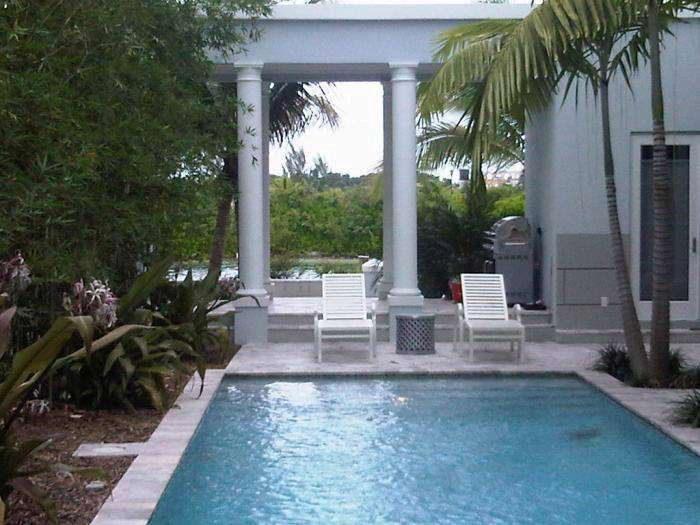 Foam columns framing a poolside patio